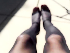 Outdoor in black pantyhose and high heels