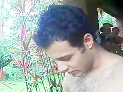 A pair of hung bisexual latino men share a nasty nympho outdoors