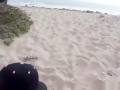 Bleach blonde is on the beach eating meat and getting stuffed