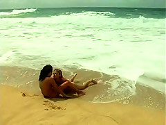 Hot lesbians babes on the beach in the sand eat pussy and lick ass