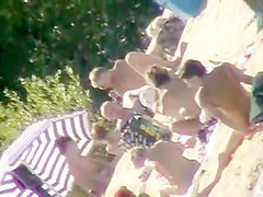 The family that sunbathes in the nude together, stays toget