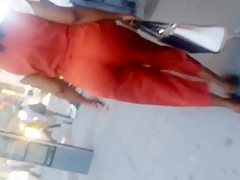 Older Lady With A Phatty In Orange Outfit.mp4
