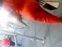Older Lady With A Phatty In Orange Outfit.mp4