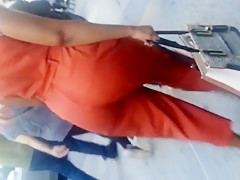 Older Lady With A Phatty In Orange Outfit.mp4