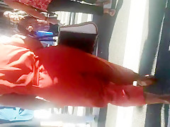 Older Lady With A Phatty In Orange Outfit.mp4