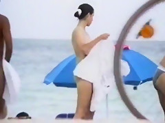 shy girl with big tits on French beach