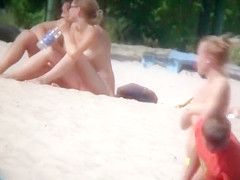 Hot young bombshells take off their bikinis to sunbathe in