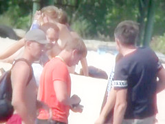 Hot young bombshells take off their bikinis to sunbathe in