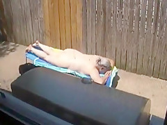 Kim Bates caught laying out in the nude. Enjoy the view.