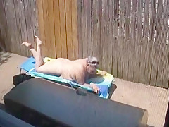 Kim Bates caught laying out in the nude. Enjoy the view.