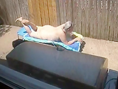 Kim Bates caught laying out in the nude. Enjoy the view.