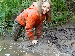 Three Girls in Mud in Winter Clothes