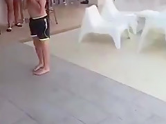 Public stripping game topless in Greece