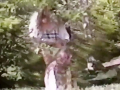 Long hair brunette strips & flashes in woods full bush