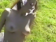 Long hair brunette strips & flashes in woods full bush