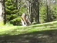 Long hair brunette strips & flashes in woods full bush