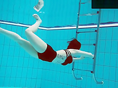 Tattooed Baby Swirls Underwater
