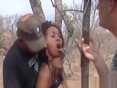 African Chick Blowing Two Stiff Cocks Outdoors