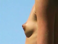 Nude guys and babes lie on the sand totally naked