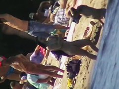 Cool babes with delicious tits taking sunbaths on a nude beach