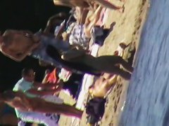 Cool babes with delicious tits taking sunbaths on a nude beach