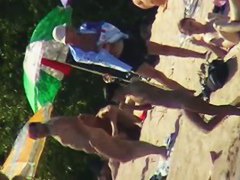 Cool babes with delicious tits taking sunbaths on a nude beach