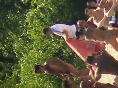 Cool babes with delicious tits taking sunbaths on a nude beach