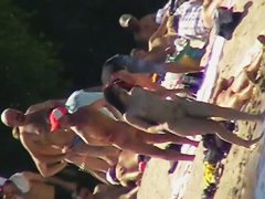 Cool babes with delicious tits taking sunbaths on a nude beach