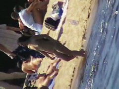 Cool babes with delicious tits taking sunbaths on a nude beach