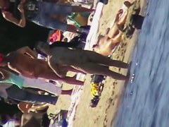 Cool babes with delicious tits taking sunbaths on a nude beach