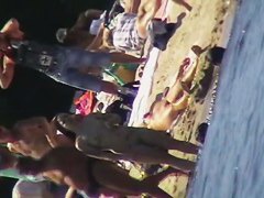 Cool babes with delicious tits taking sunbaths on a nude beach