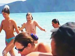 Buxom nude beach babes flaunt their jugs before a hidden camera