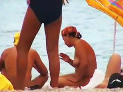 Buxom nude beach babes flaunt their jugs before a hidden camera