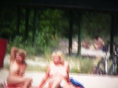 Brunette cutie with a perky butt filmed on a nudist beach