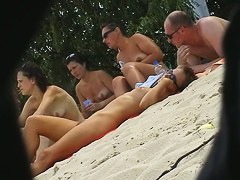 Hot babes filmed lounging on a nudist beach