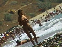 Naked mature babe caught by nude beach voyeur