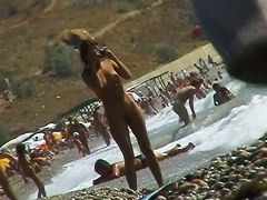 Naked mature babe caught by nude beach voyeur