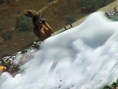 Naked mature babe caught by nude beach voyeur