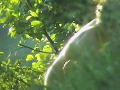 A tempting bimbo feeling giddy on a nude beach