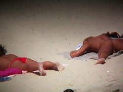 Big breasted woman meeting a hunk on the nude beach