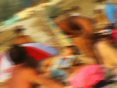 Naked hotties showing their pussies at the beach