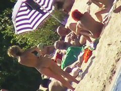 Sexy people on the beach having fun voyeur video