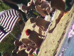 Sexy people on the beach having fun voyeur video