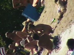 Sexy people on the beach having fun voyeur video