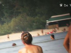 Black hair topless woman in the nude beach candid video