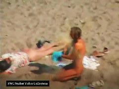 cooling down on the nudist beach two slim babes in full view
