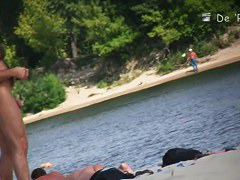 Cutie flaunts her perky tits in front of a nudist beach voyeur