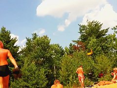 Naked people enloyong the sun on the beach