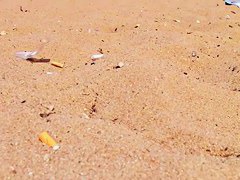 Naked people enloyong the sun on the beach