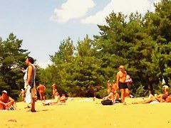 Naked people enloyong the sun on the beach